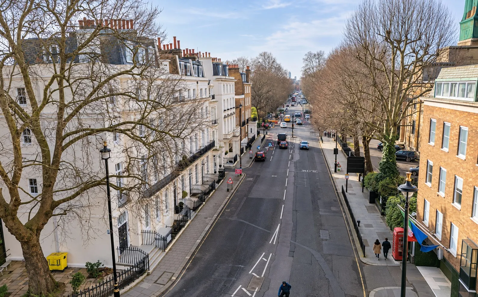 Tree-lined Belgravia street with white stucco terraces, seen from first-floor height