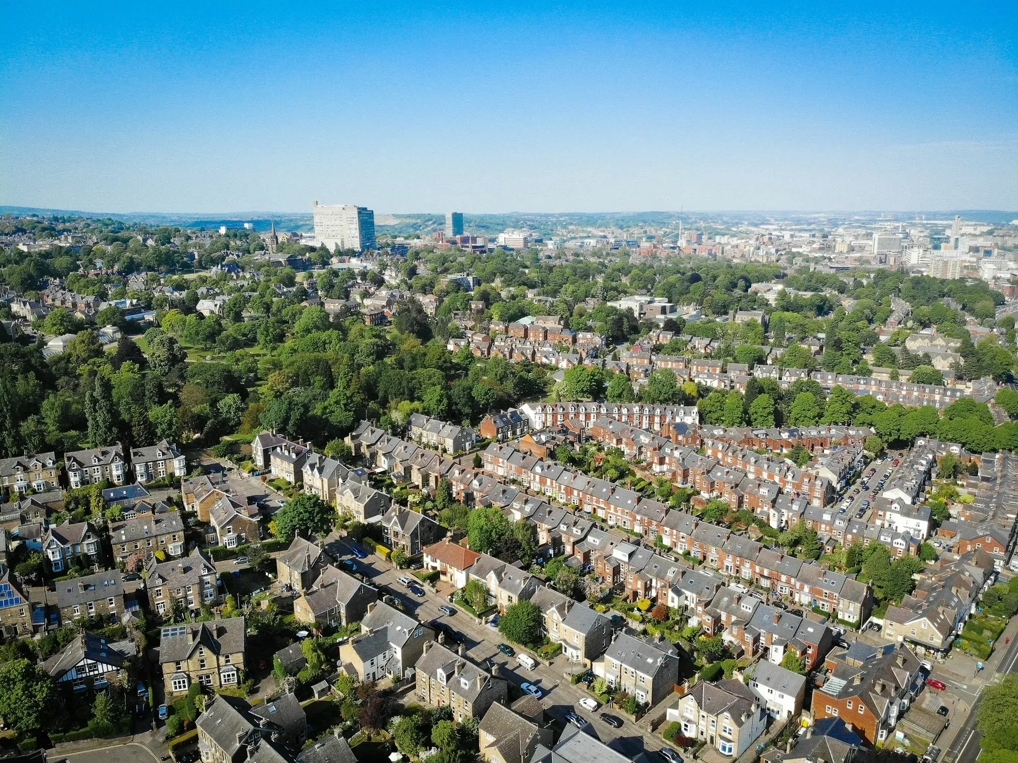 Aerial view of terraced streets with long back gardens and mature trees